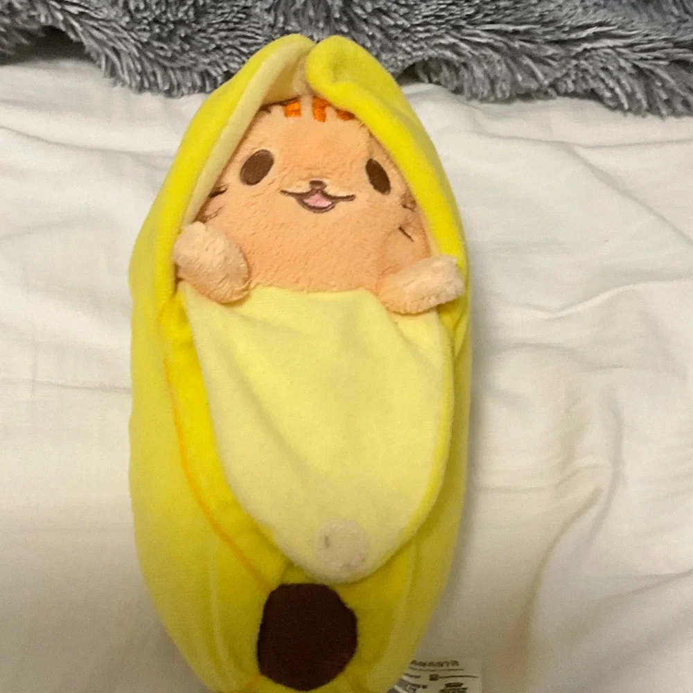 Open and close Velcro banana cat stuffy.